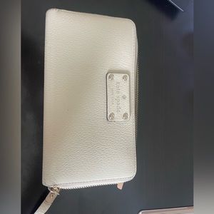 Cream colored Kate Spade zip wallet